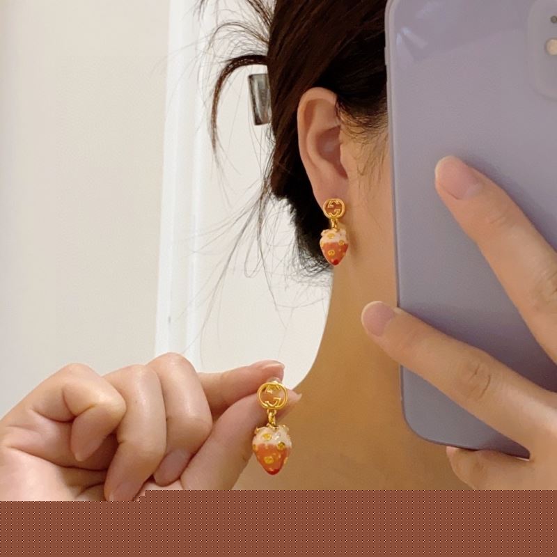 G*u*i earrings